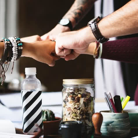 collaboration-colleagues-cooperation-398532 Fist pump