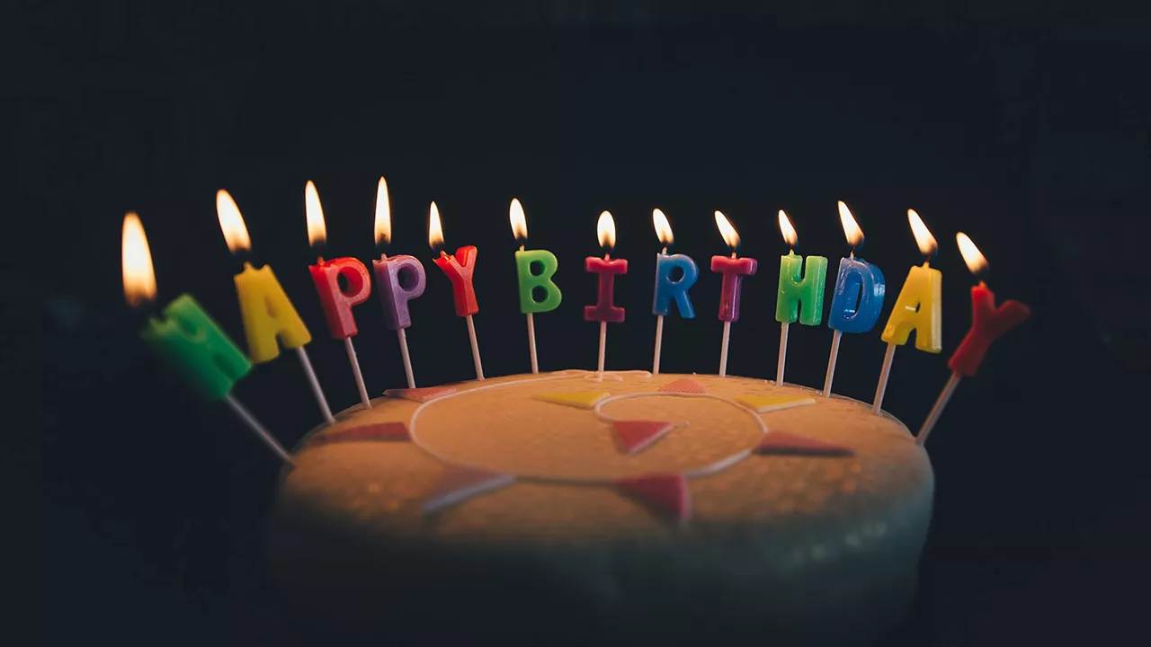 Birthday cake with lit candles