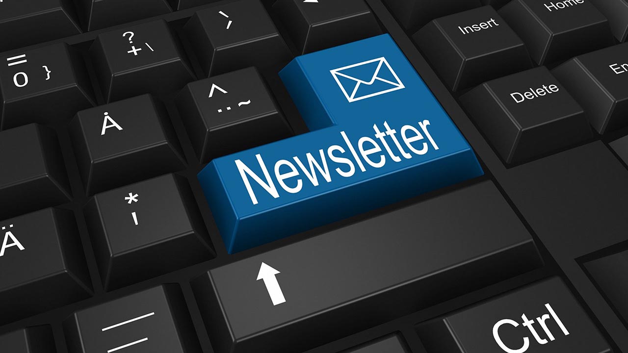 Email newsletter displayed on keyboard